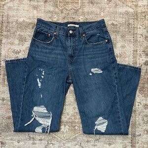 Woman’s Dark Blue Distressed Levi’s Low Pro Straight